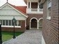 This prewar charm Hamilton home kept its timeless calm while a separate garage and two story addition was added.